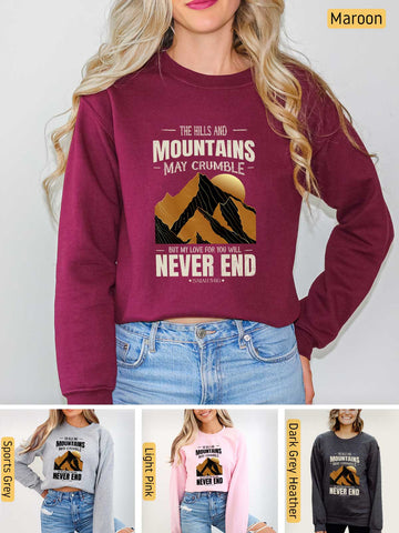 a woman wearing a sweatshirt that says mountains may crumble never end