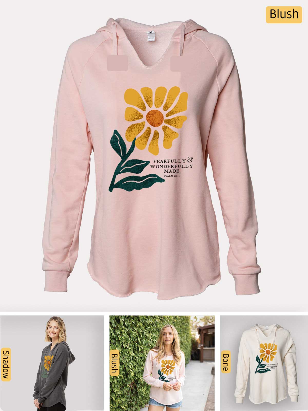 a pink sweatshirt with a yellow flower on it
