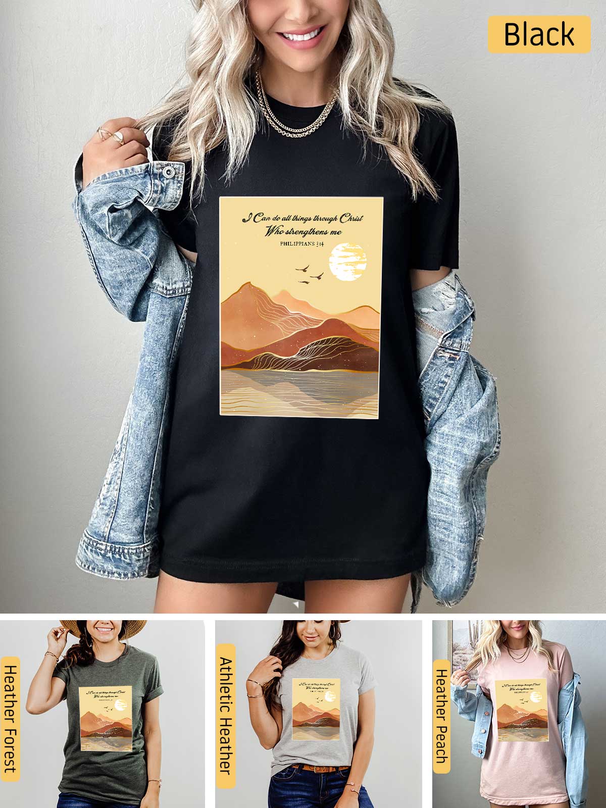 a woman wearing a black t - shirt with a picture of mountains on it