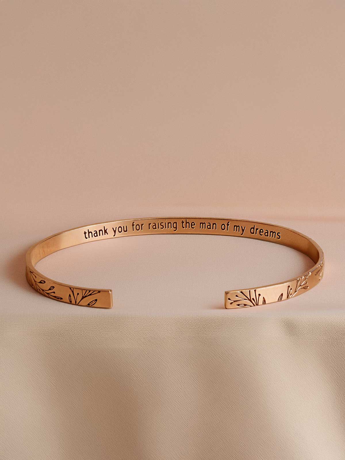 a close up of a bracelet on a table