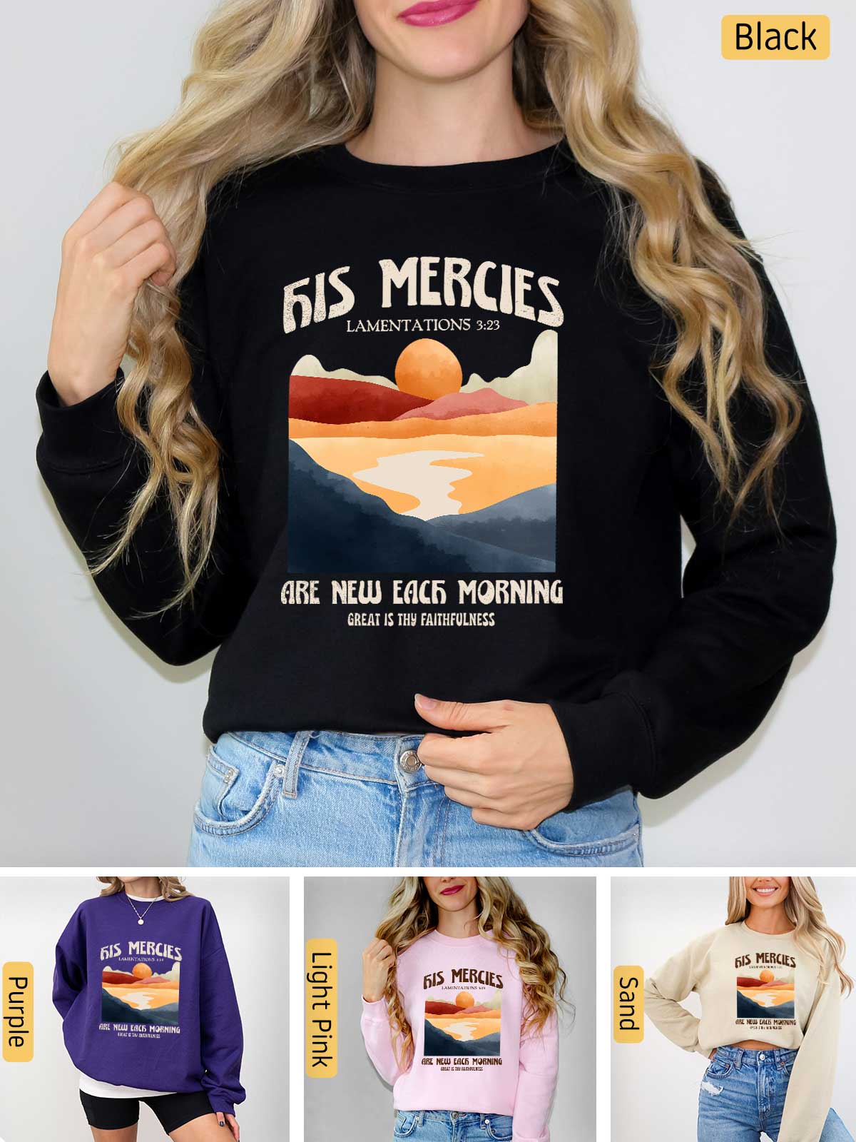 a woman wearing a black sweatshirt with a sunset on it