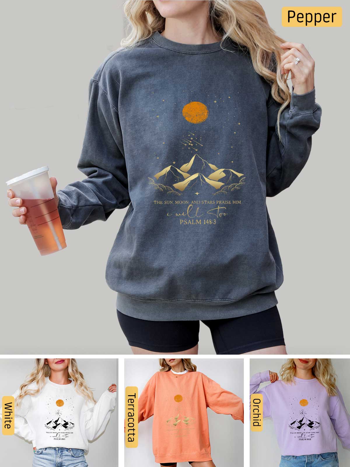 a woman wearing a sweatshirt with a mountain scene on it