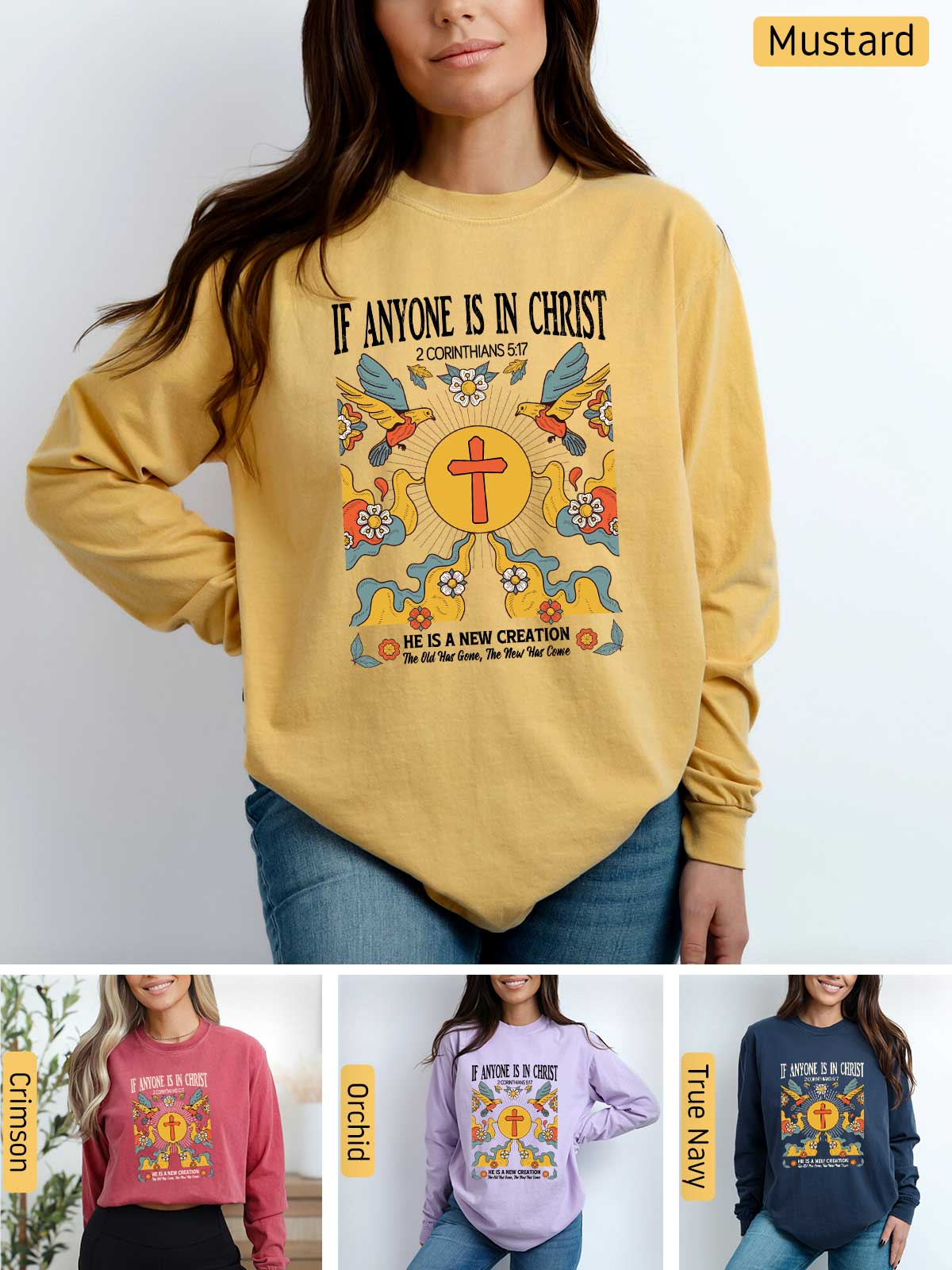 a woman wearing a mustard colored sweatshirt with the words if anyone is in christ on