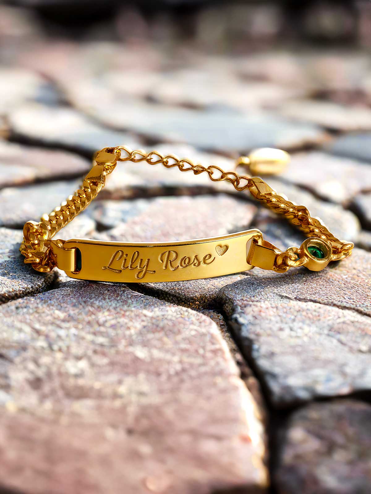 a close up of a bracelet on a stone surface