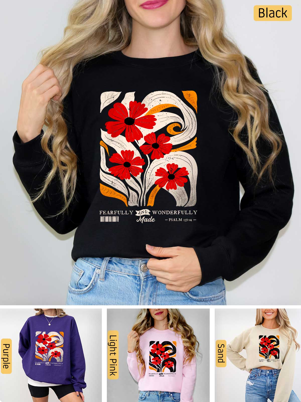 a woman wearing a black sweater with red flowers on it