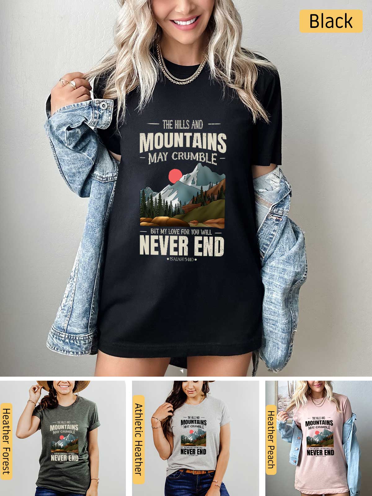 a woman wearing a black shirt with mountains and sunsets on it