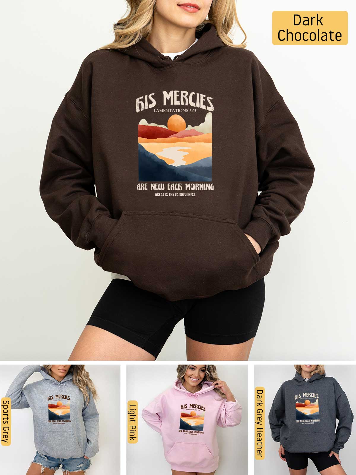 a woman wearing a hoodie with a picture of a sunset on it