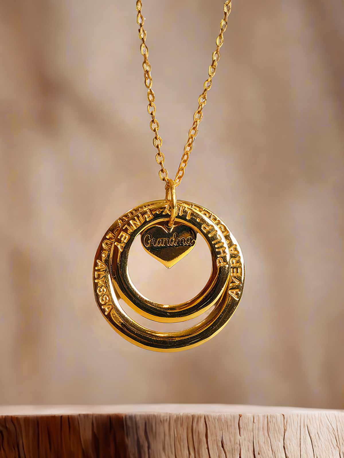 a gold necklace with two interlocked circles