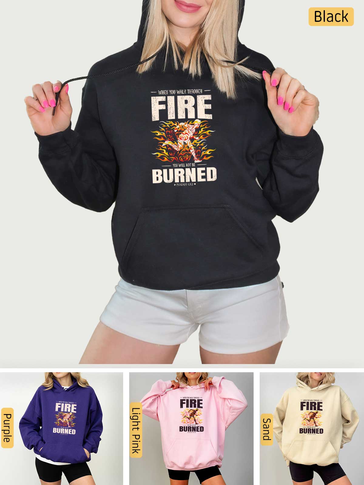 a woman wearing a black hoodie with fire burned on it