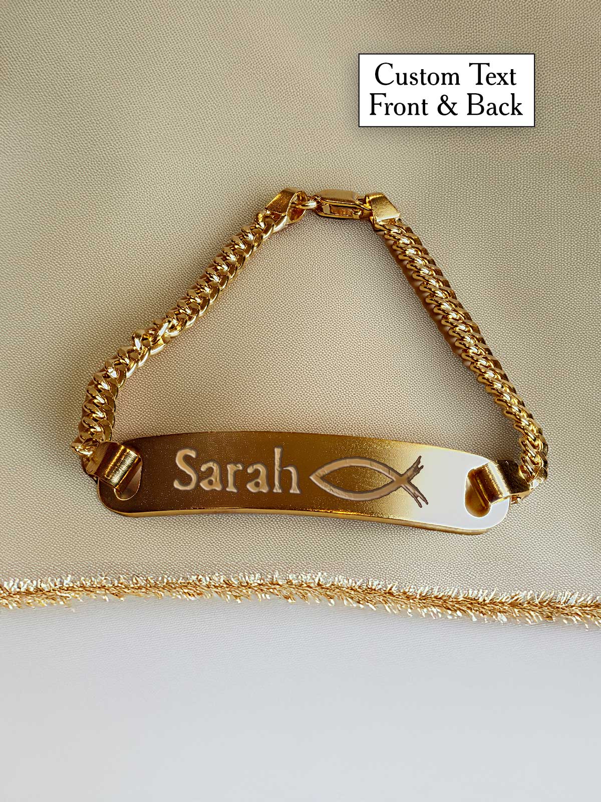 a gold bracelet with a name tag on it