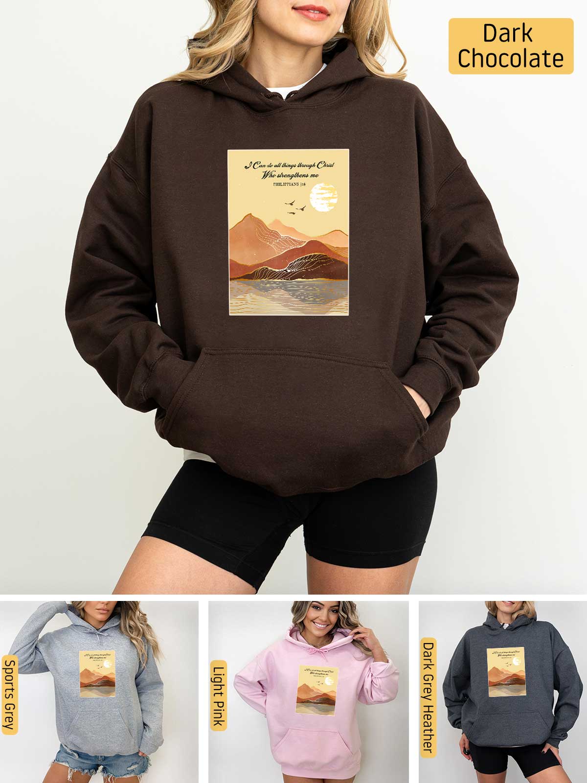 a woman wearing a brown hoodie with a picture of mountains on it