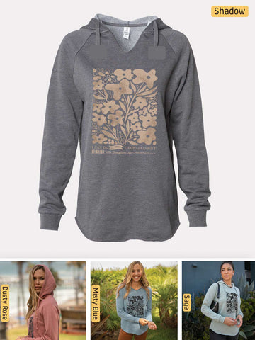 a women's hoodie with a picture of a tree on it