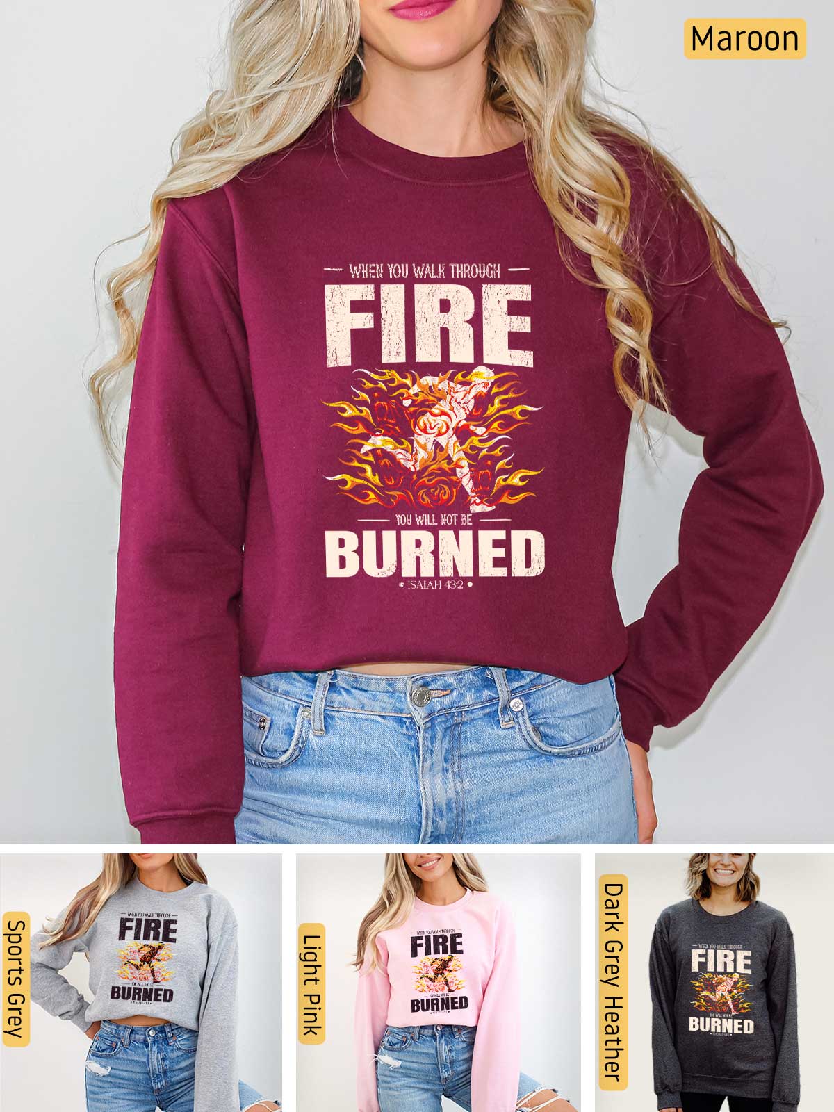 a woman wearing a fire burned sweatshirt and jeans