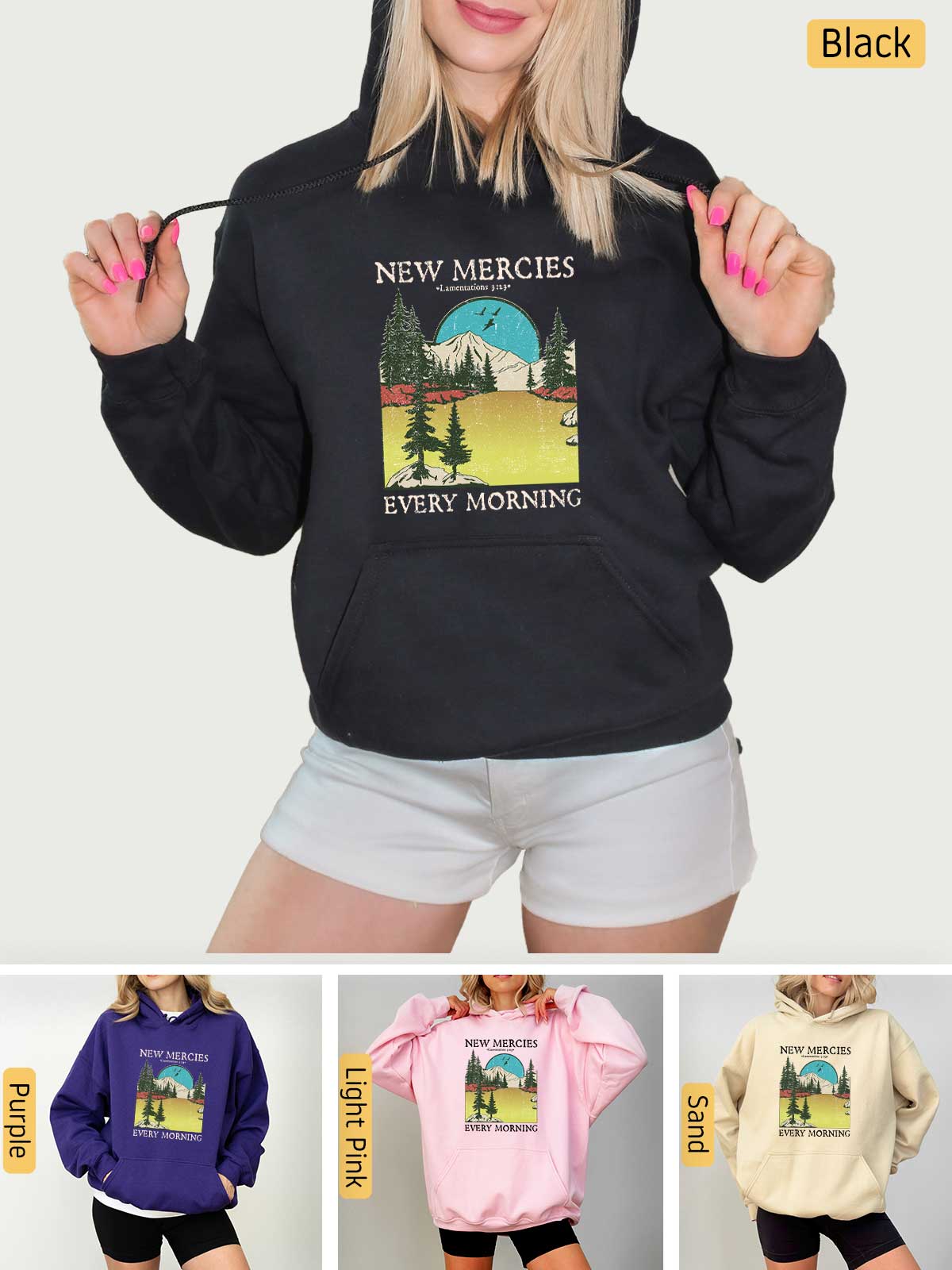 a woman wearing a new mercies sweatshirt and shorts