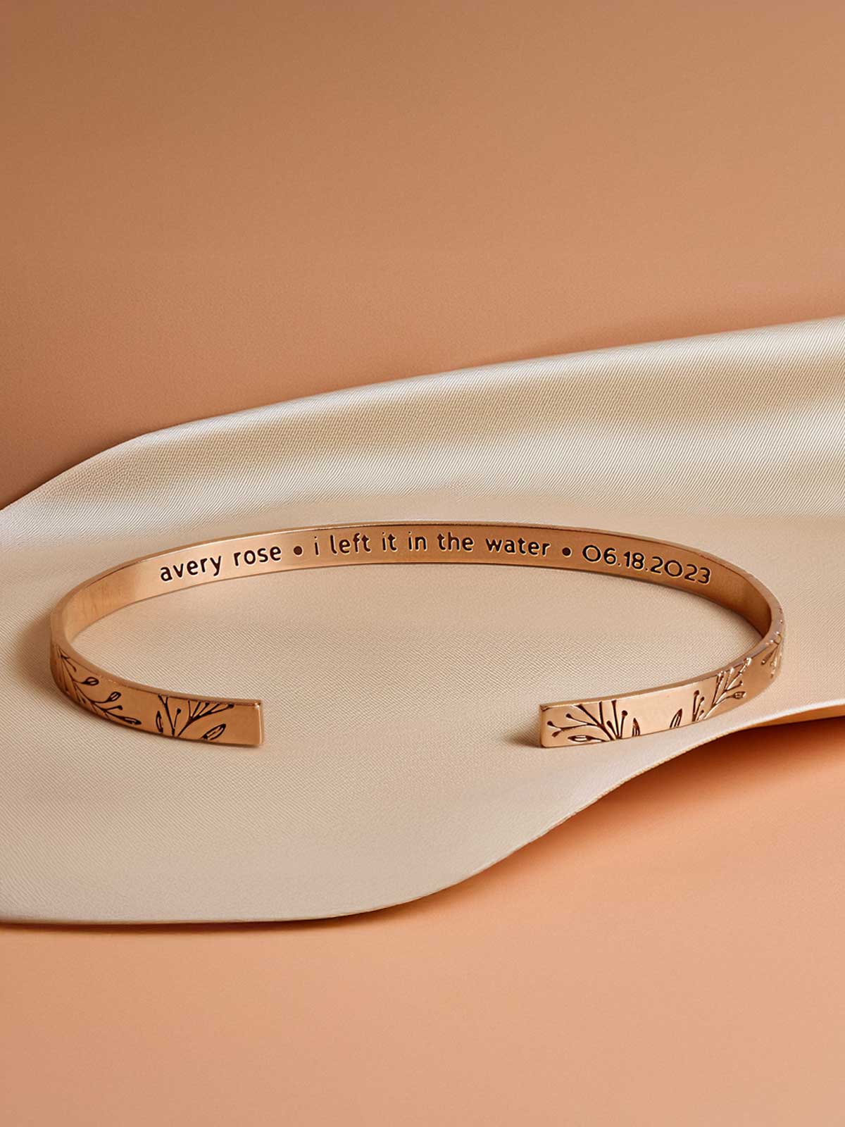 a bracelet with a message on it sitting on a pillow