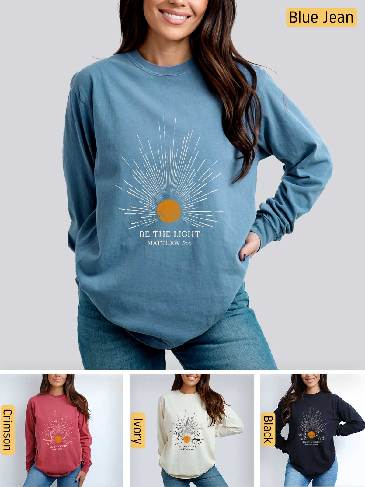 a woman wearing a blue sweatshirt with the words be the light on it