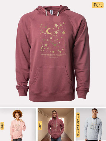 a man wearing a pink hoodie with stars and a moon on it