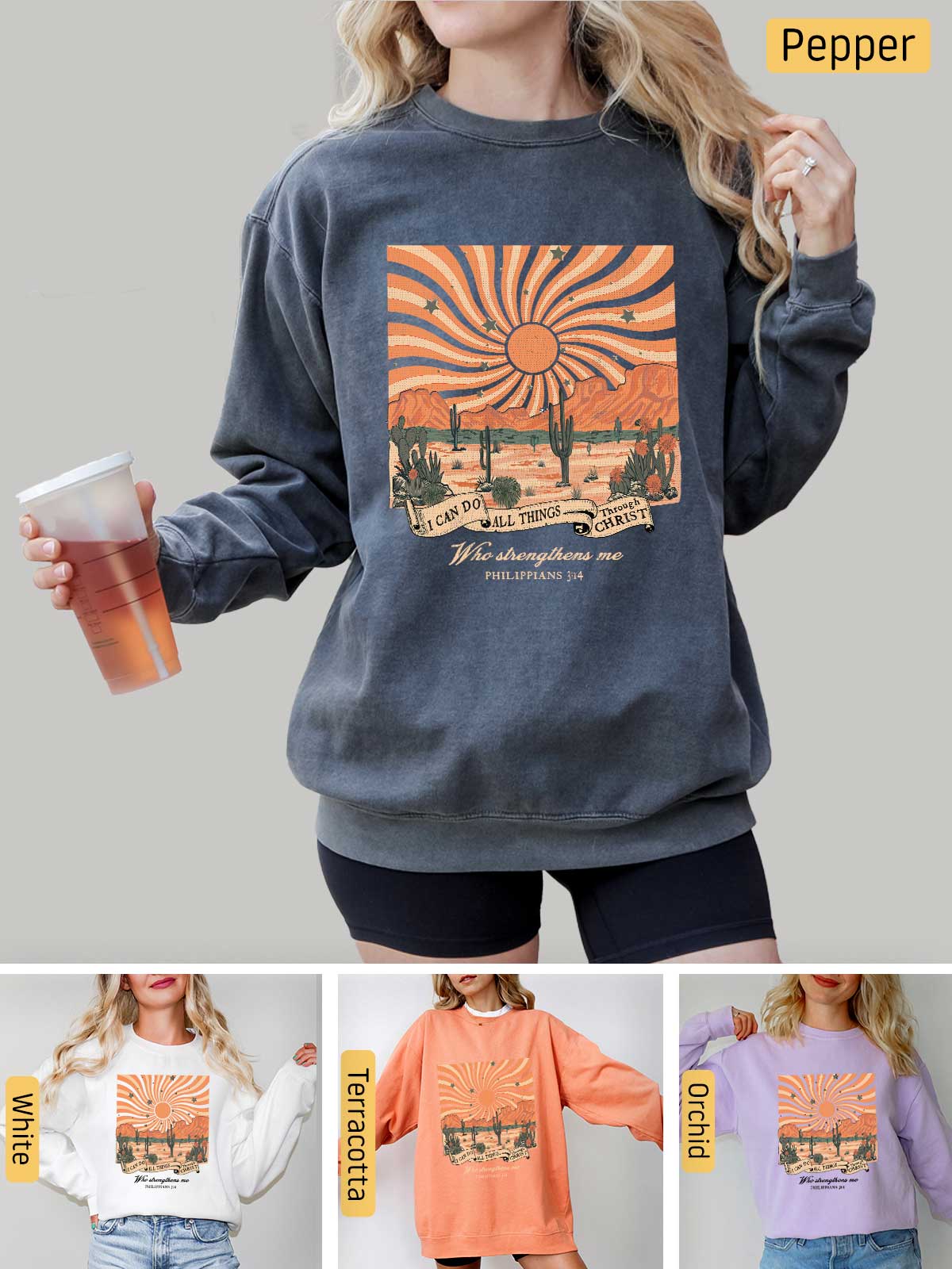 a woman wearing a sweatshirt with a graphic of a sunset