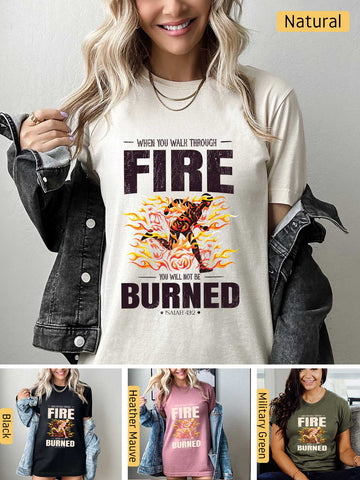a woman wearing a t - shirt that says fire burned