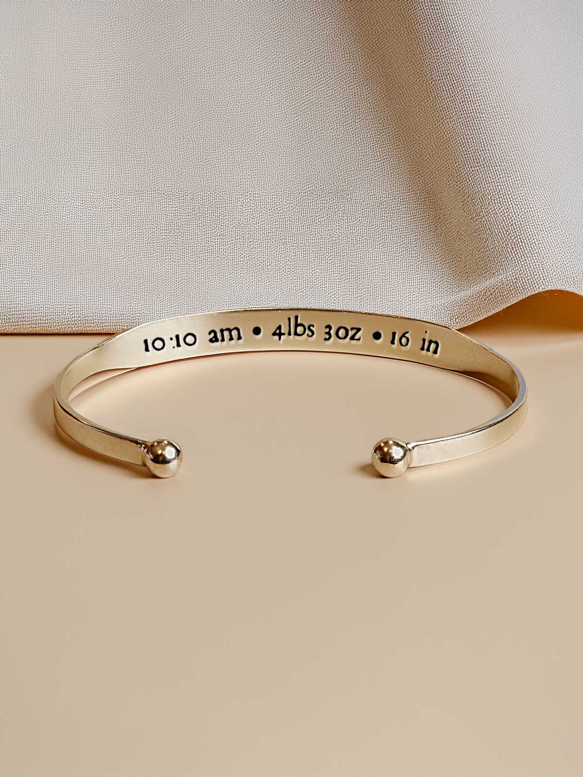 a cuff bracelet with a message on it