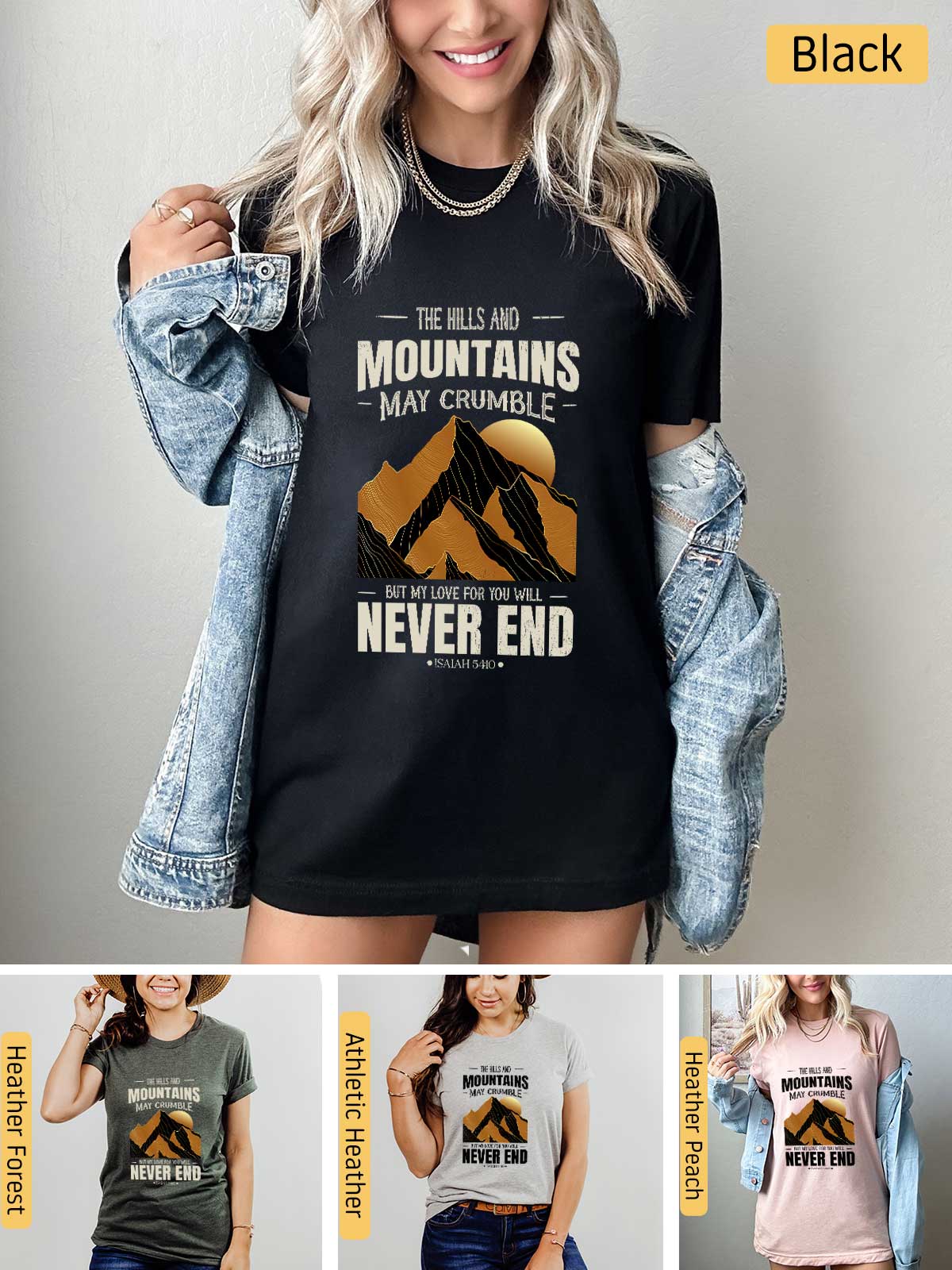 a woman wearing a black shirt with mountains on it