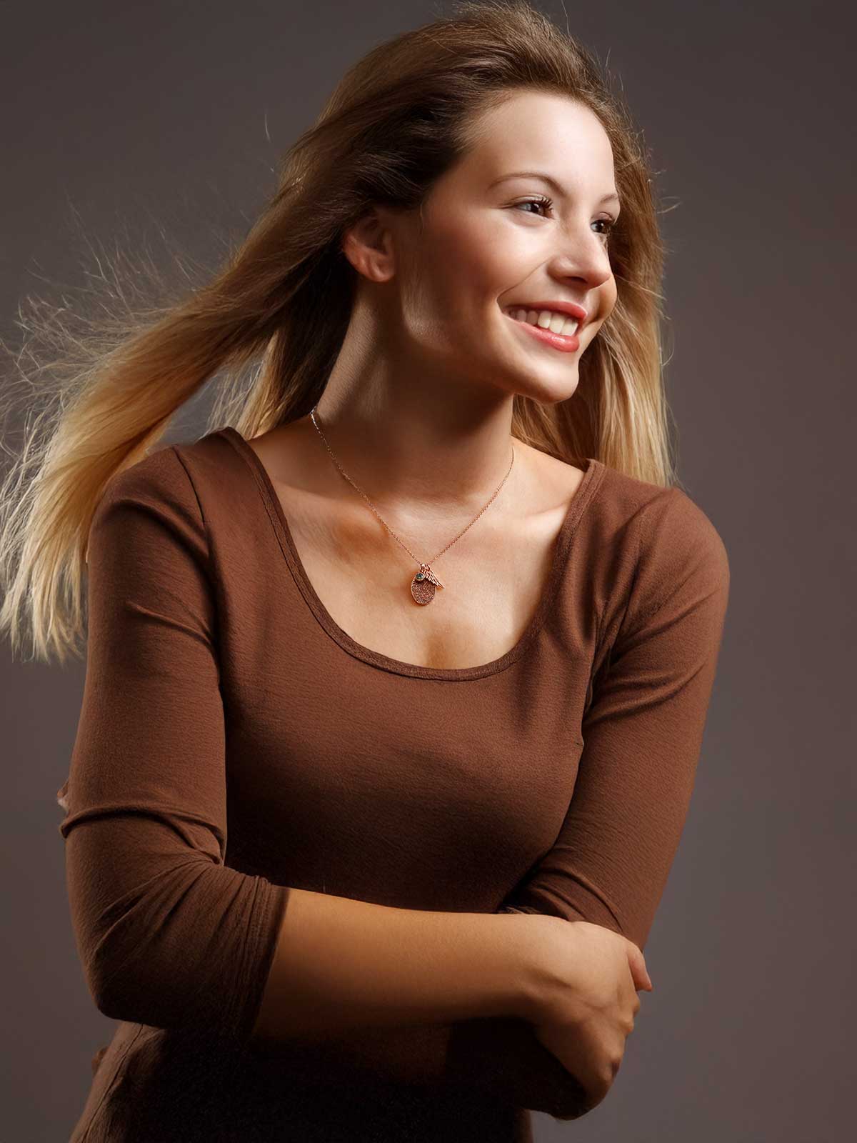 a woman with her hair in a ponytail