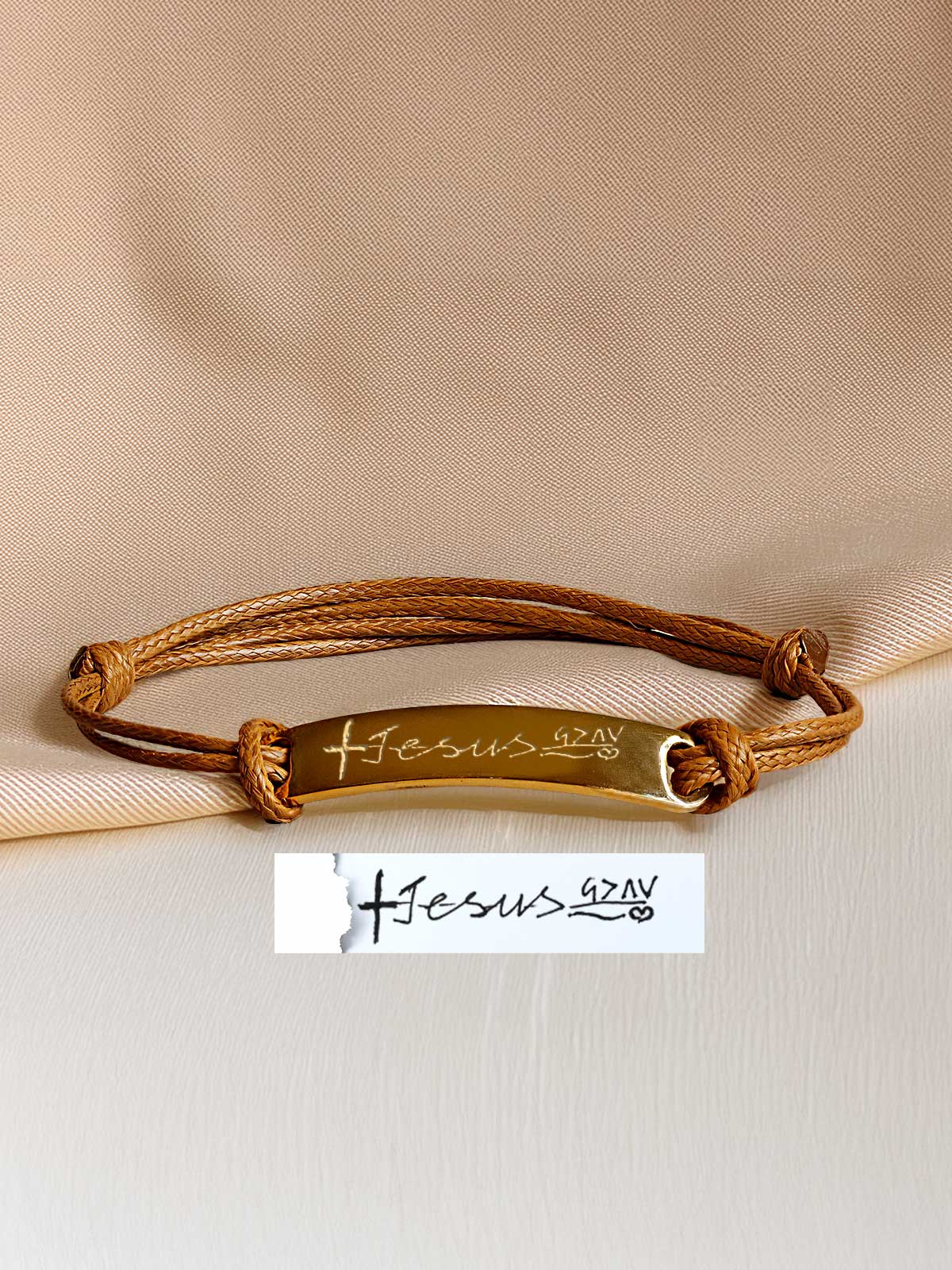 a close up of a bracelet with a name tag