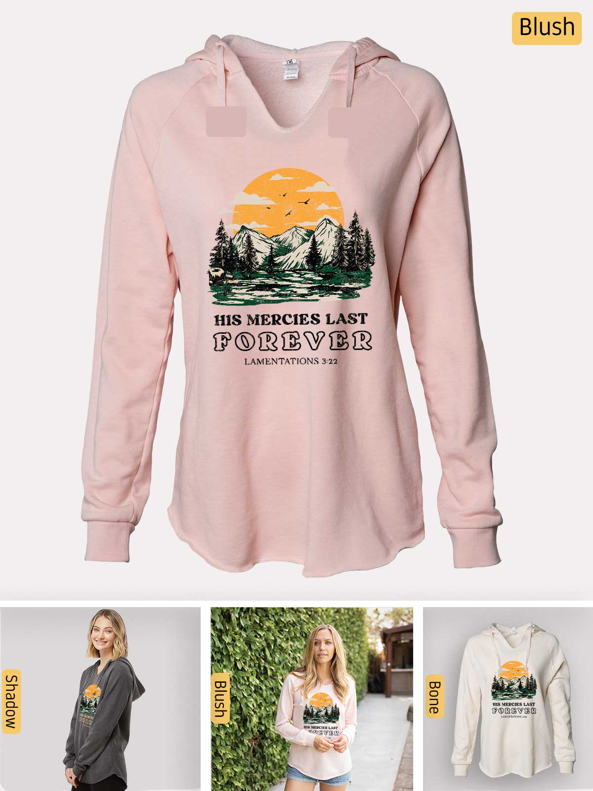a women's pink hoodie with a picture of trees and mountains on it