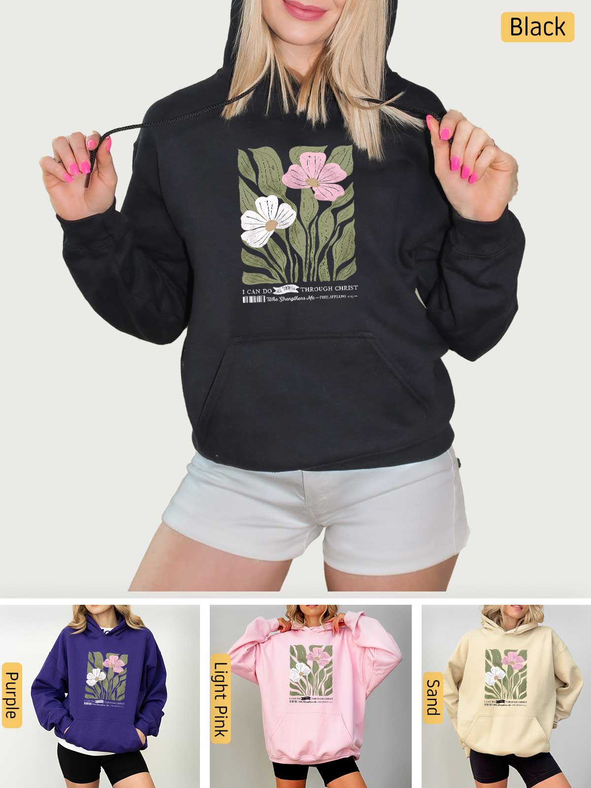 a woman wearing a black hoodie with flowers on it