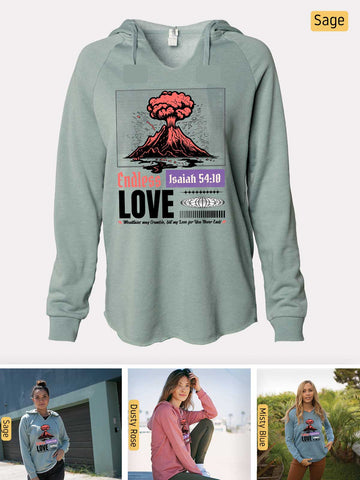 a woman wearing a sweatshirt with a picture of a volcano on it