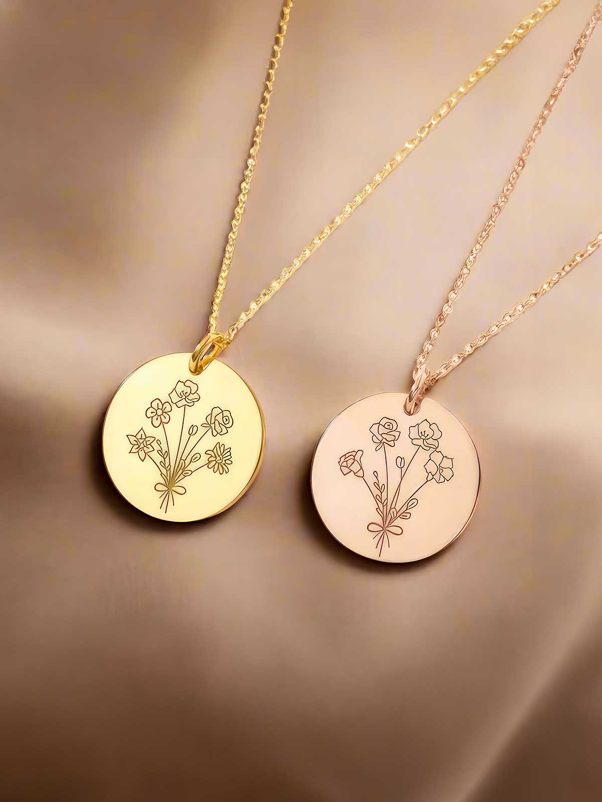 two necklaces with flowers engraved on them