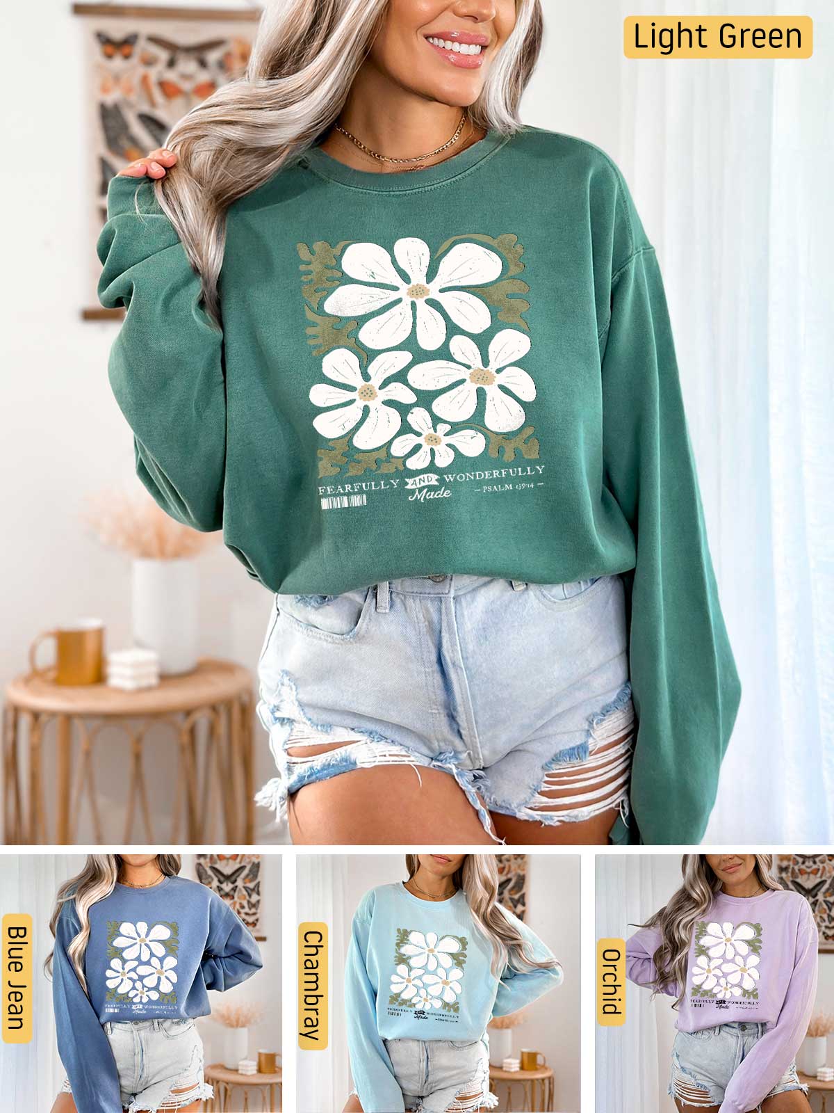 a woman wearing a green sweatshirt with white flowers on it