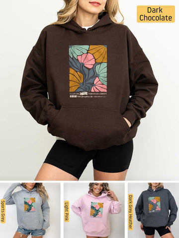 a woman wearing a brown hoodie with a picture of a tree on it