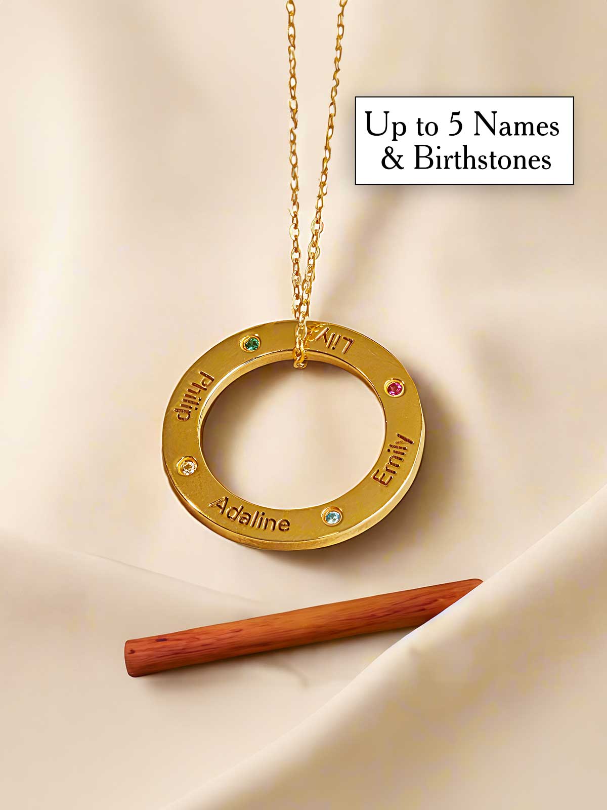 a gold plated necklace with a name on it