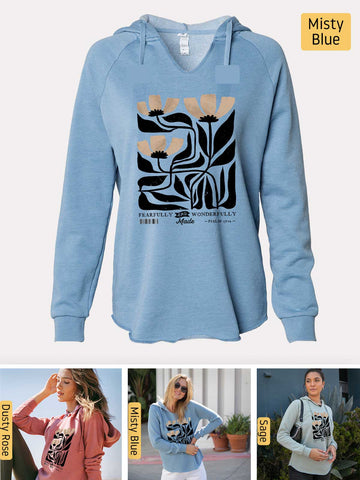 a woman wearing a blue sweatshirt with a graphic on it
