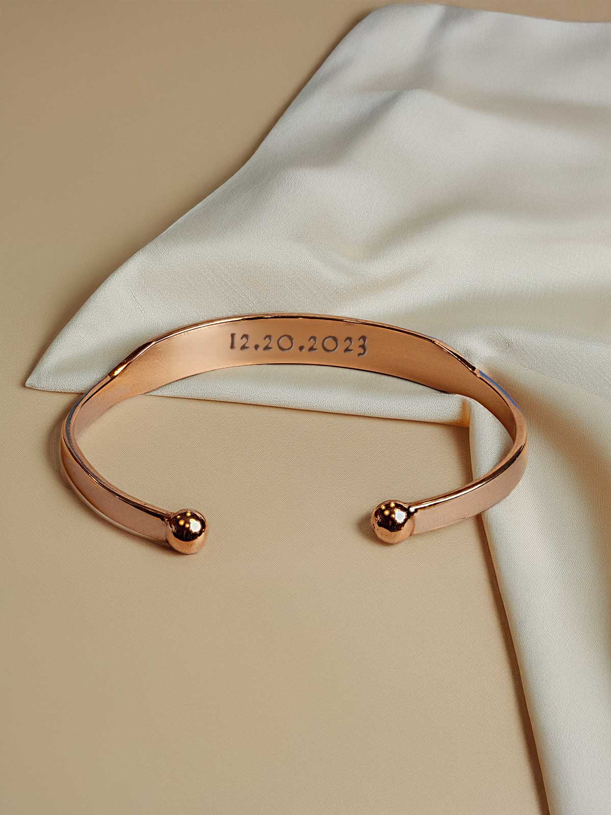 a close up of a bracelet with a name on it