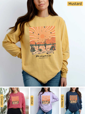a woman wearing a mustard colored sweatshirt with a picture of a desert scene