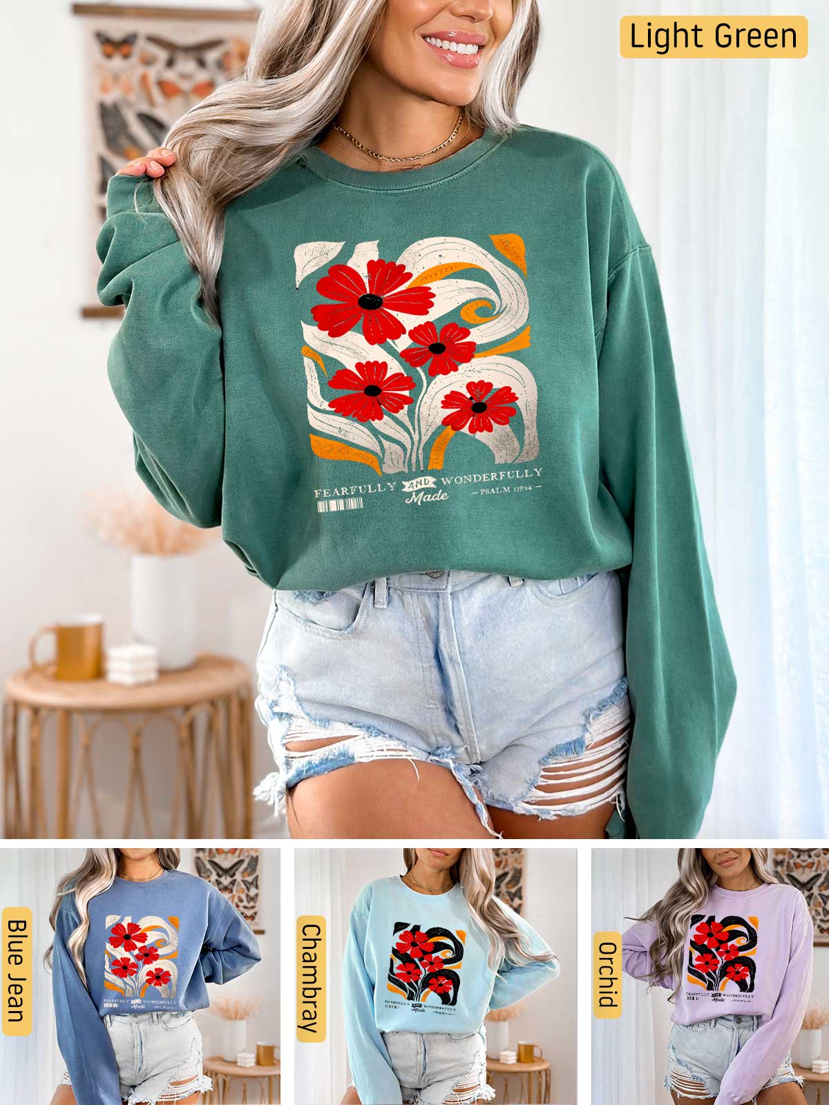 a woman wearing a green sweatshirt with red flowers on it