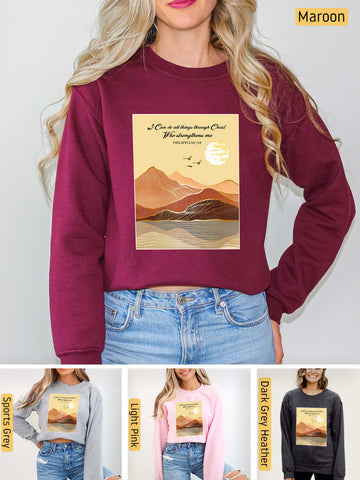 a woman wearing a maroon sweatshirt with a mountain scene on it