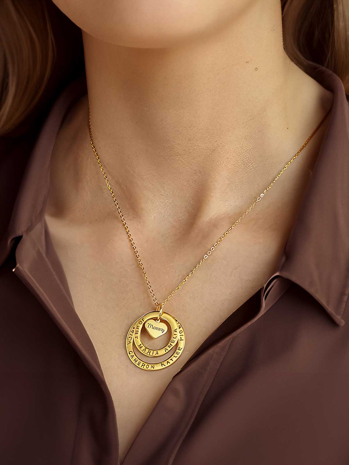 a close up of a woman wearing a gold necklace