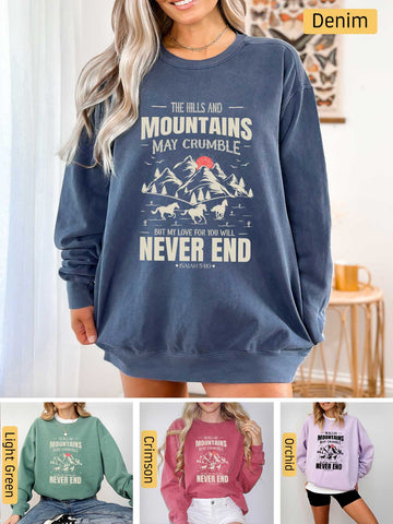 a woman wearing a sweatshirt that says the mountains may crumble never end