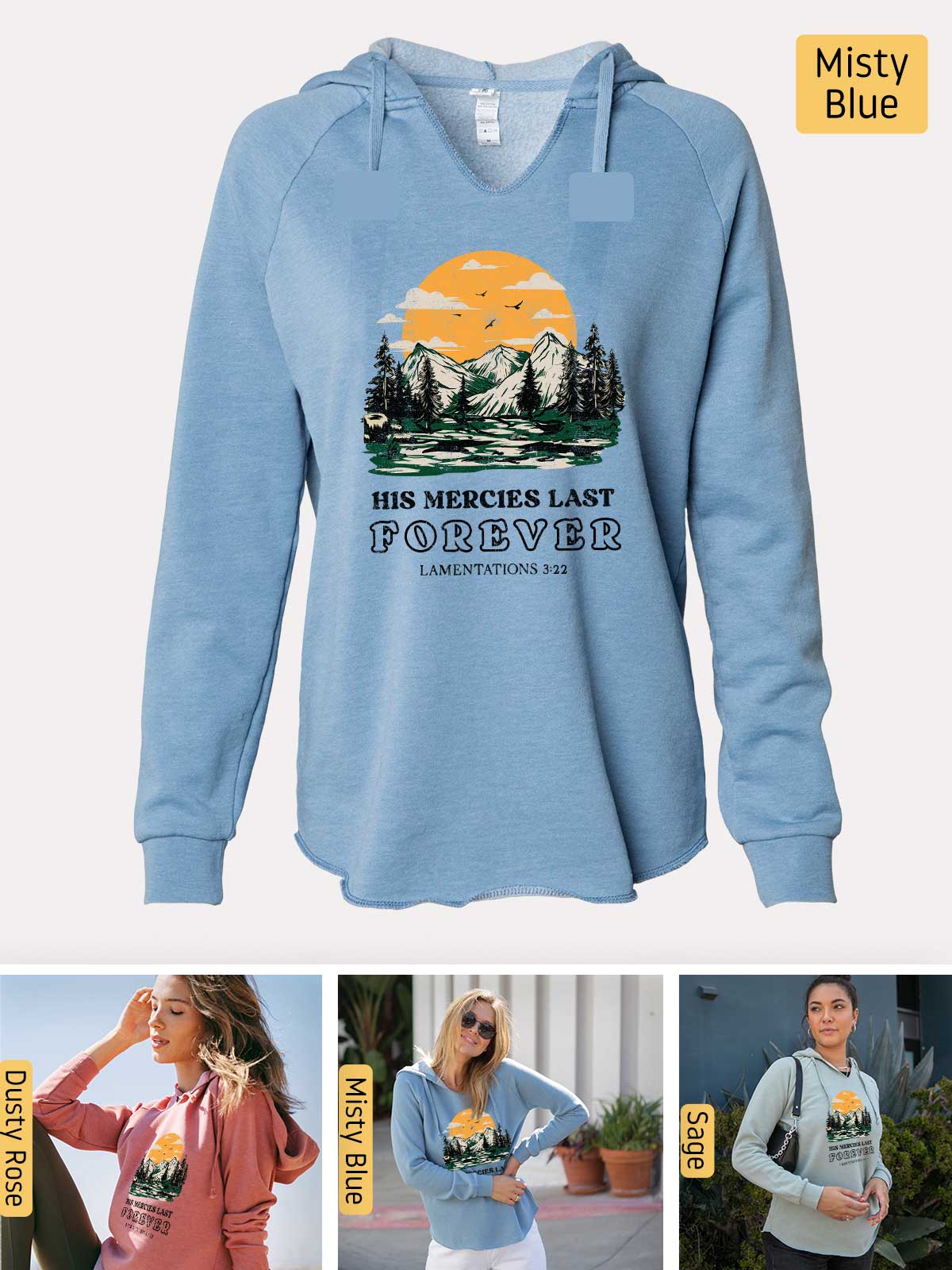 a woman wearing a blue hoodie with a picture of mountains and trees on it