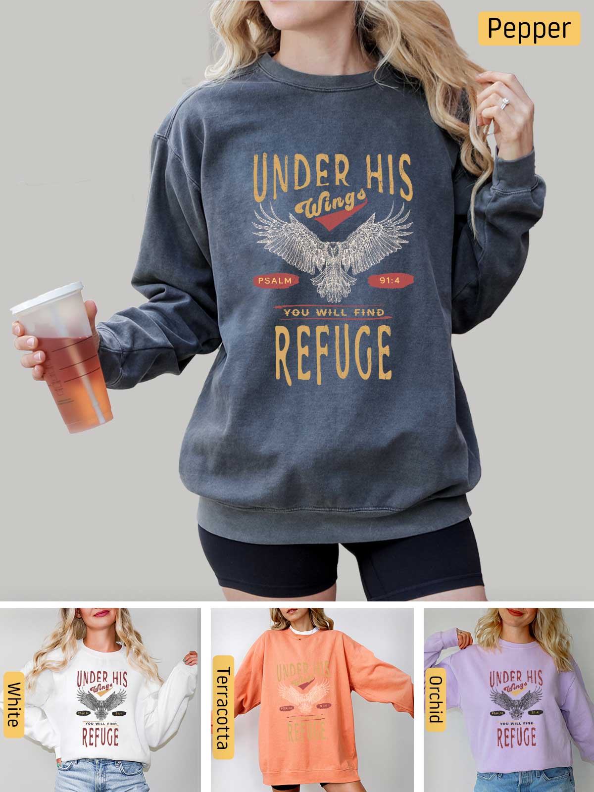 a woman wearing a sweatshirt with the words under his refuge on it