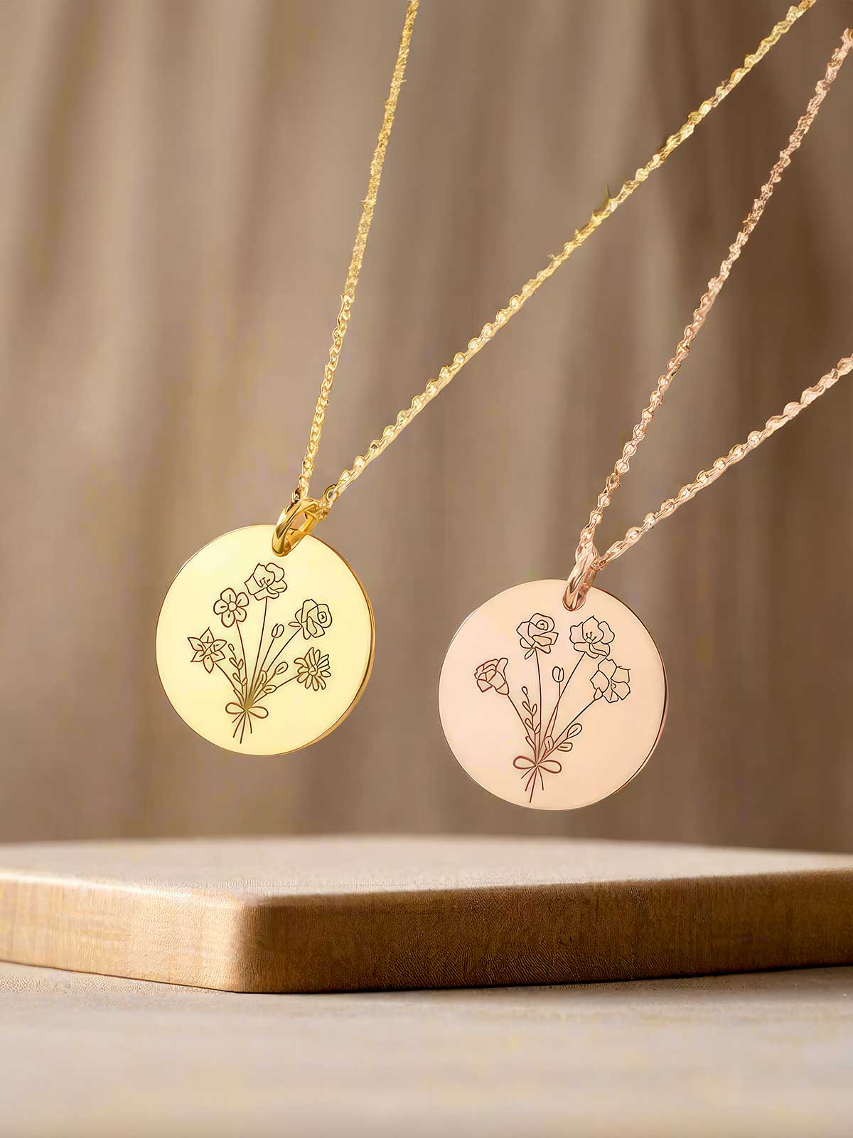 a couple of necklaces sitting on top of a wooden table