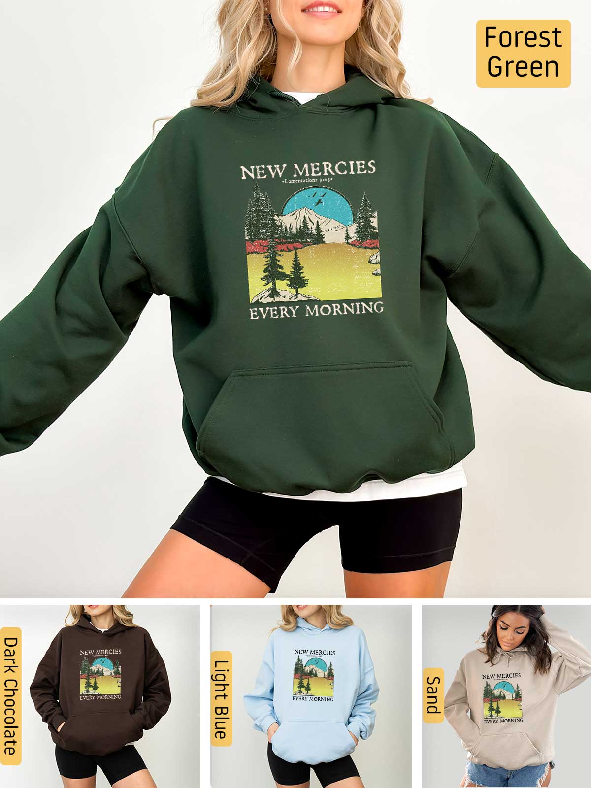 a woman wearing a new mercies sweatshirt and shorts