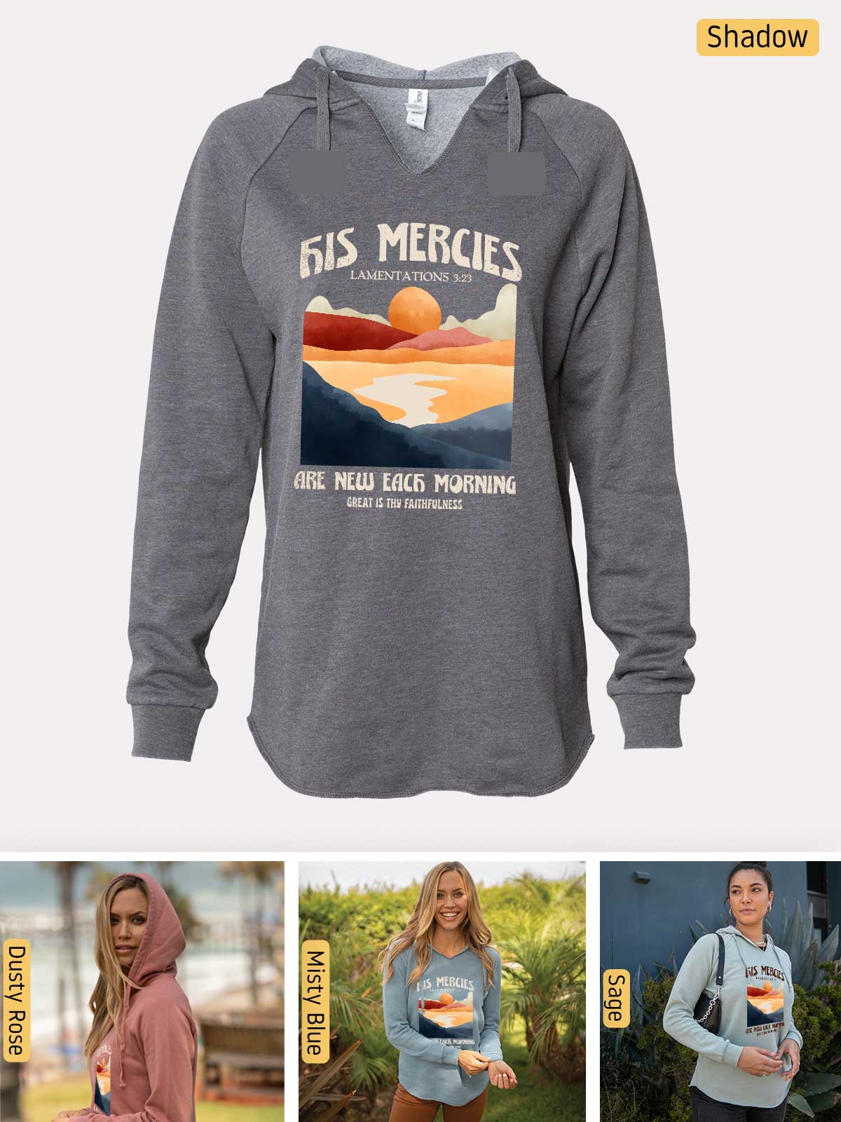 a woman wearing a sweatshirt with a sunset on it