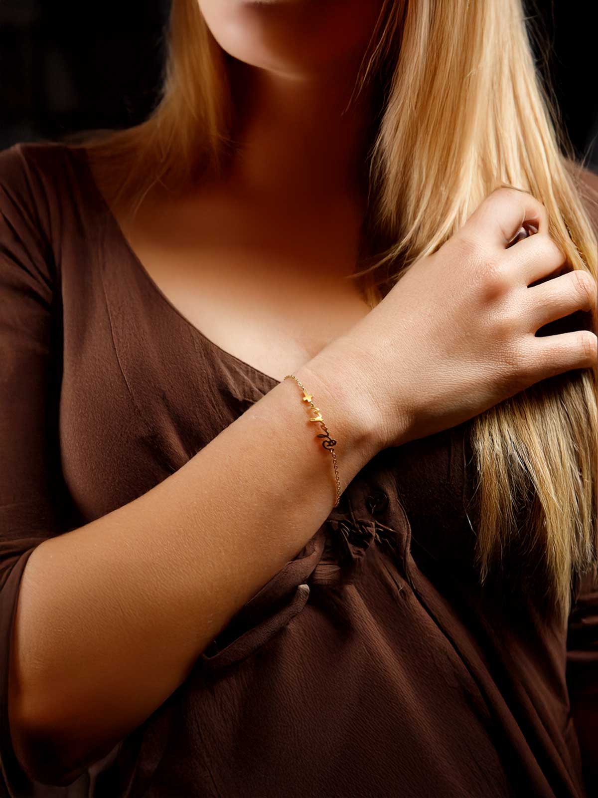 a woman with a bracelet on her wrist