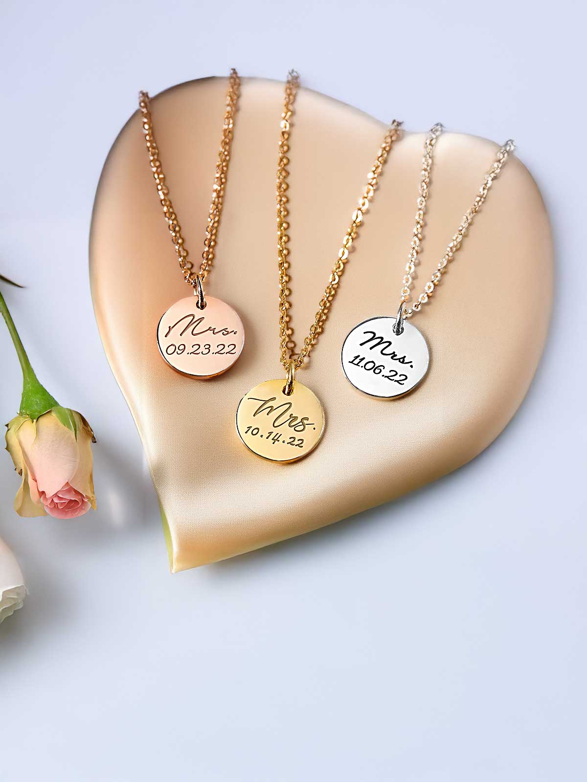 a heart shaped plate with three different necklaces on it